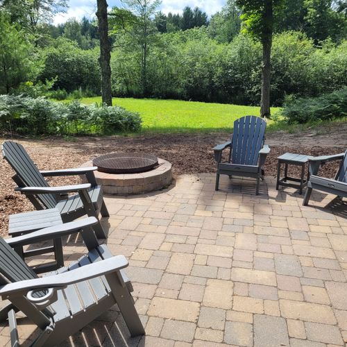 Exterior:  the backyard patio, which includes the bonfire ring and hot tub (not shown in photo).