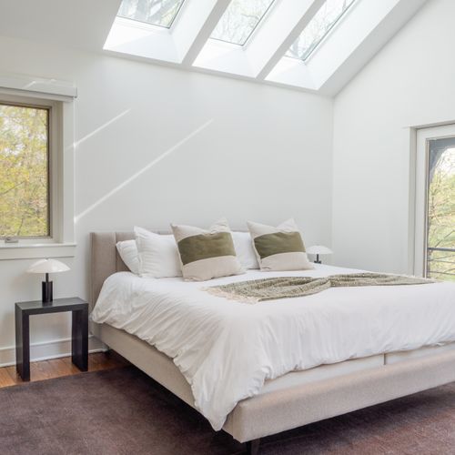 The primary bedroom, completely private on its own level of the home.