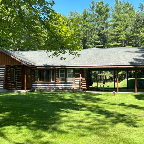 Exterior:  another view of the front of the cabin in summer.