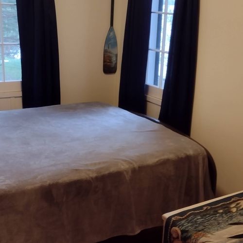 Bedroom #1:  features a full-size bed, nightstand, lamp, dresser. And closet.