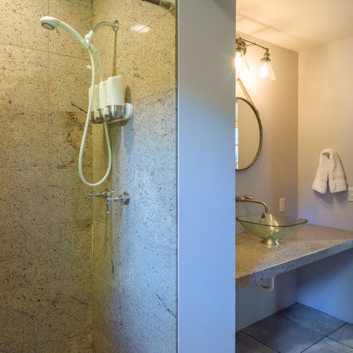 Bathroom with shower equipped with toiletries