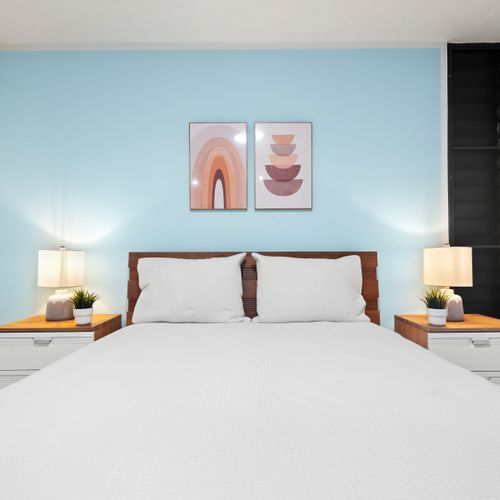 Restful retreat with stylish furnishings and ample light.