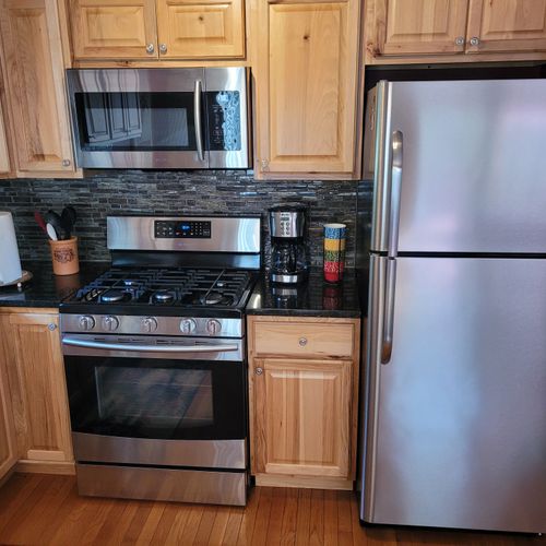 KITCHEN:  The home has a very modern kitchen with all appliances including a dishwasher.
