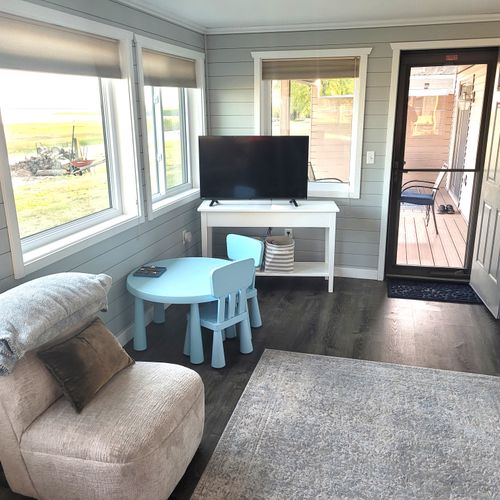 SUNROOM:  The home has a very fun and family-friendly sunroom off of the living room.  It features great views of Lake Huron.