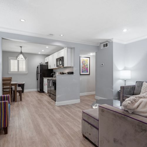 Open-concept kitchen & living area designed for easy cooking & hangouts.