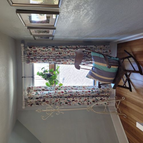 Bedroom #4 (second floor):  this very cute upstairs bedroom features two twin-size beds, a nightstand, lamp, pedestal fan, chair, and a large walk-in closet.