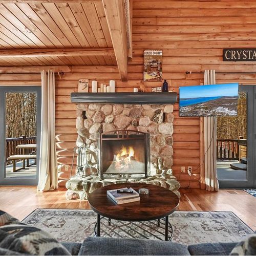 Living room:  the comfy living room with a huge wood fireplace!