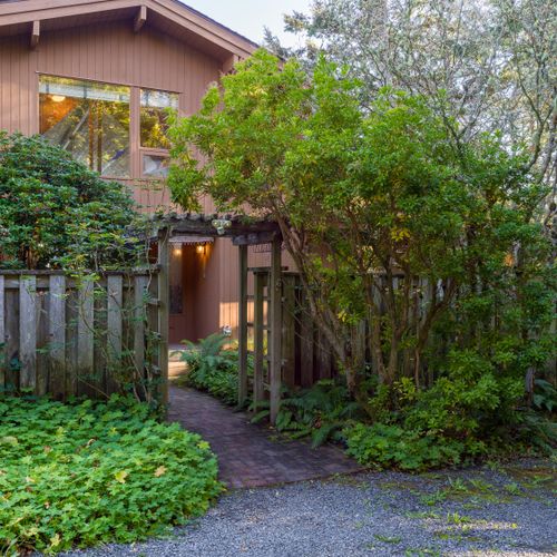 Front gate to Spotted Deer Hideaway and the fenced gardens surrounding the house.