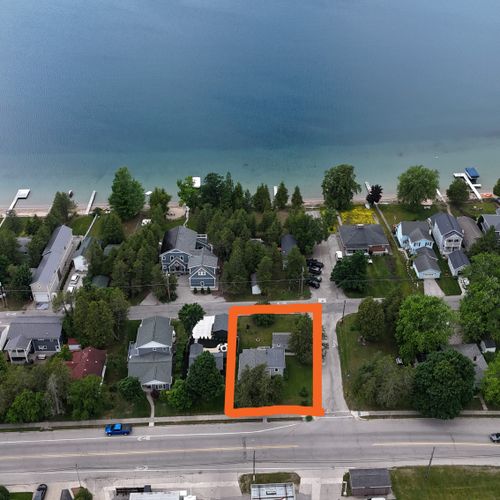 OVERVIEW:  Aerial view of the cottage with Crystal Lake in the background