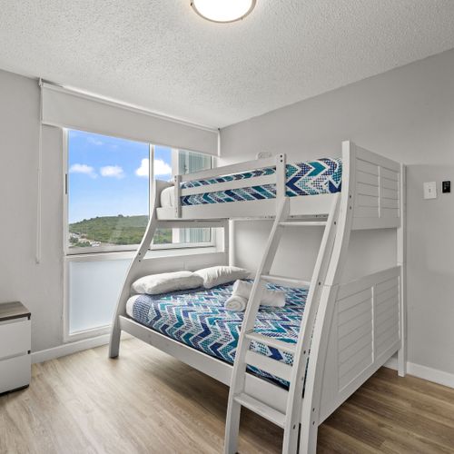 Adventure awaits for the younger guests (or young at heart)! This fun and functional room features sturdy bunk beds, providing a comfortable and exciting sleeping arrangement for kids or extra guests.