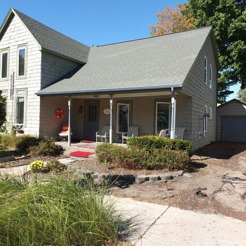 Exterior:  the front of the home facing the street, with the driveway on the right.