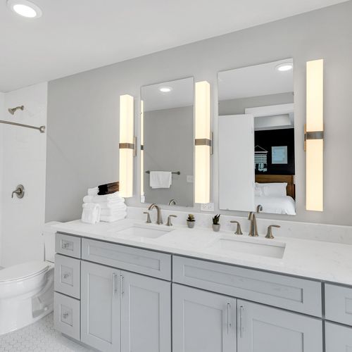 Bright and airy bathroom with double sinks and plenty of natural light.