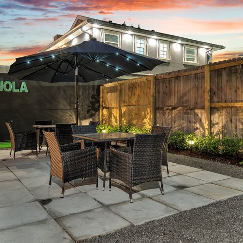 Unwind with an evening meal or drinks under the twinkling lights in this cozy outdoor seating area – the perfect spot to soak in those NOLA vibes