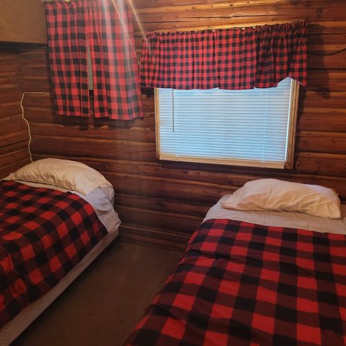 Bedroom #2:  features 2 twin size beds, nightstand, lamp, closet, and dresser