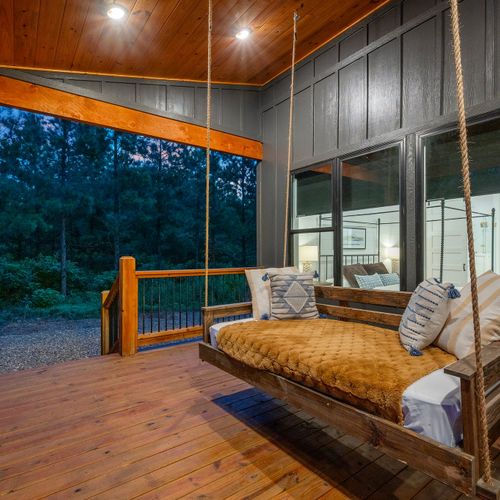 Hanging daybed on the covered porch.