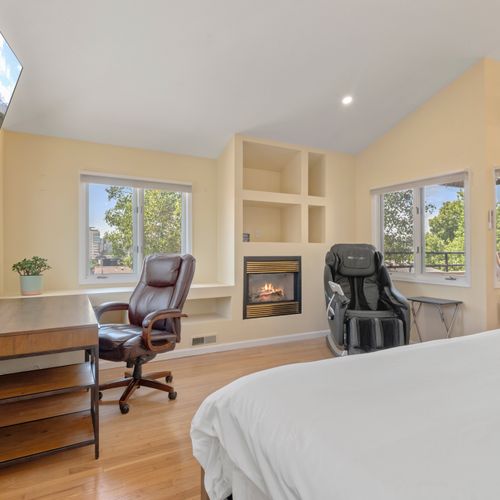Tranquil retreat with plush king bed, soft lighting, and dreamy bedding ensemble.