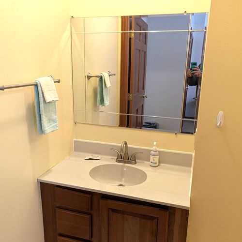 BATHROOM #3:  This is a "jack and jill full bathroom" with private entrances from both Bedroom #3 and Bedroom #4.  Includes 2 separate sinks each with a mirror and vanity along with a toilet and a combination tub and shower.