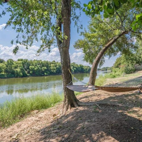 Relax on the hammock by the banks of the Brazos River under the shady trees