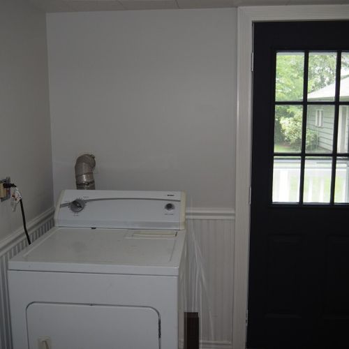 Laundry room:  just off of the kitchen, the home has a very convenient first-floor laundry room with a new washer and dryer!