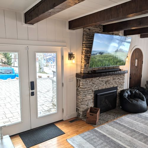 LIVING ROOM (MAIN FLOOR):  Gorgeous main floor living room with a large live streaming television, gas fireplace, and lots of seating!