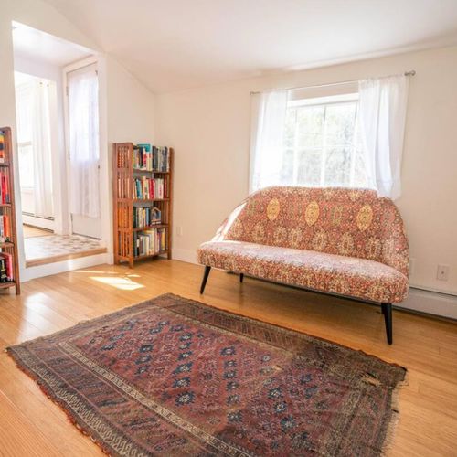 Around the corner is our small library, perfect for curling up with a good book