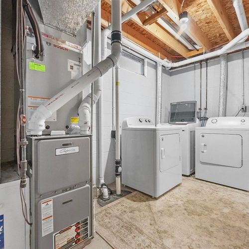 Laundry room (lower level):  there is a washing machine and 2 dryers in the lower level.