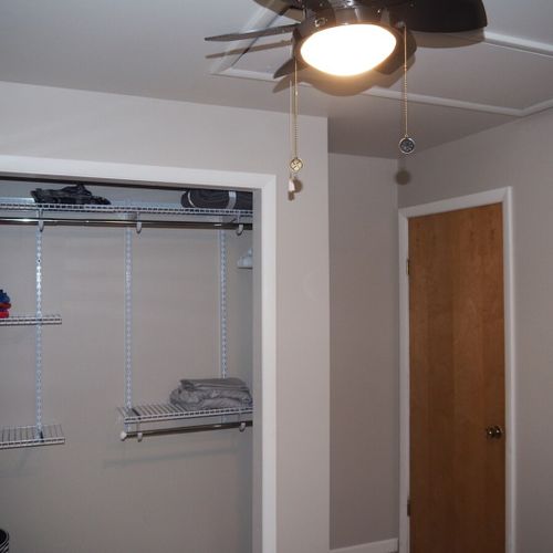 Bedroom #1:  features a queen-size bed, ceiling fan, and closet.
