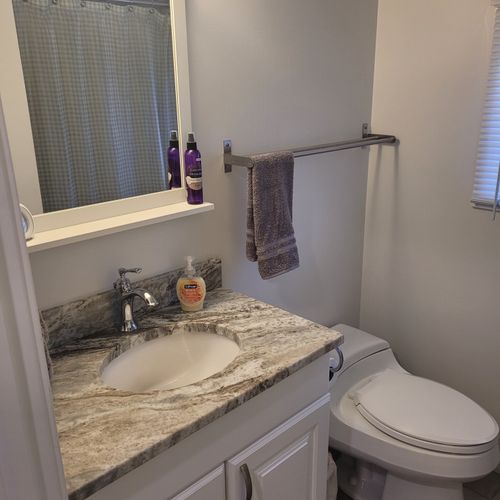 Bathroom #2:  full common bathroom on the main floor with a combination tub and shower.