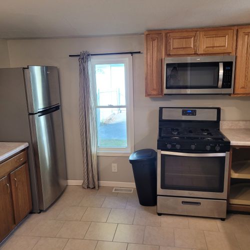 Kitchen:  the home has a fairly large kitchen with all appliances including a dishwasher. Also has a good supply of cooking and dining utensils.