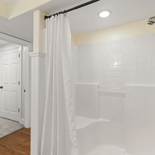 BEDROOM #4 (LOWER LEVEL):  Full bathroom on the lower level with a walk-in shower.
