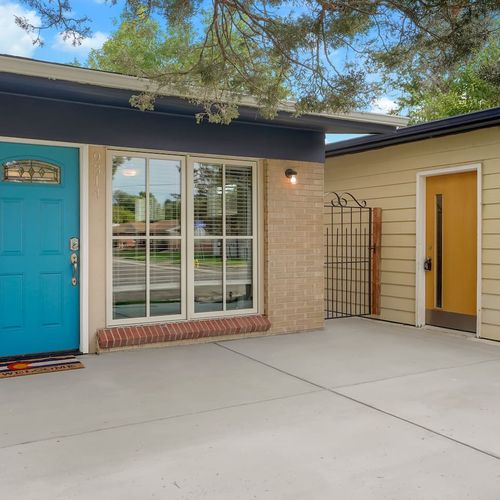 - bright blue front door and charming patio space greet you with warmth and style
- plenty of room to gather, unload, or enjoy a quiet moment in the fresh air
- great visibility and smooth entryway make check in easy and accessible