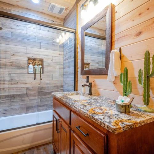 Private bathroom with tub/shower combo.