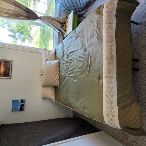 Bedroom #2 ( second floor):  features a full-size bed, a twin bed, a ceiling fan, and a closet.