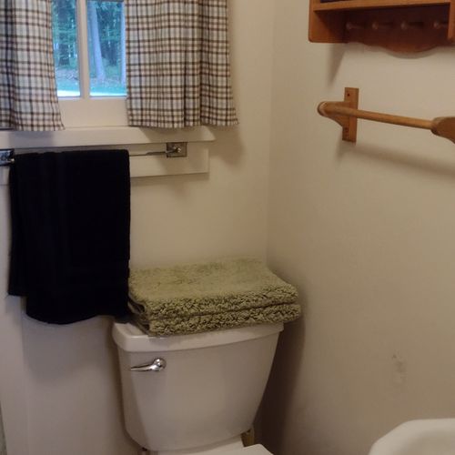 Bathroom:  the cabin has a full bathroom with a shower, sink, and toilet.