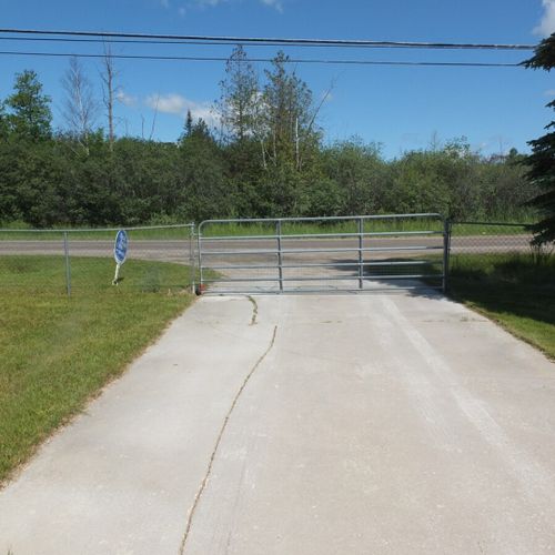 Exterior:  as shown, the entrance is gated and the gate just manually rotates to open and close.