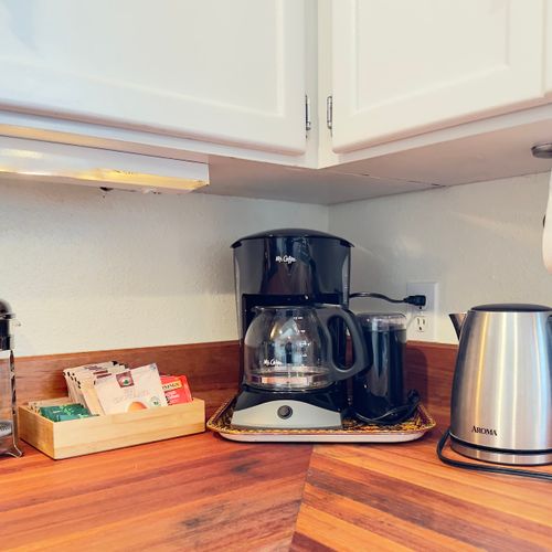 Brew a fresh pot, make a cup of tea, or press your favorite beans before heading out for the day. We’ve set up a simple coffee and tea station so slow mornings and easy starts feel right at home.