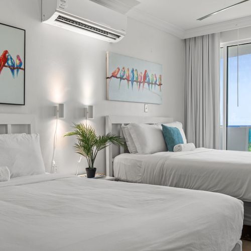 Enjoy the best of indoor comfort and outdoor beauty in this elegant studio. Large windows and a balcony offer unobstructed ocean vistas.