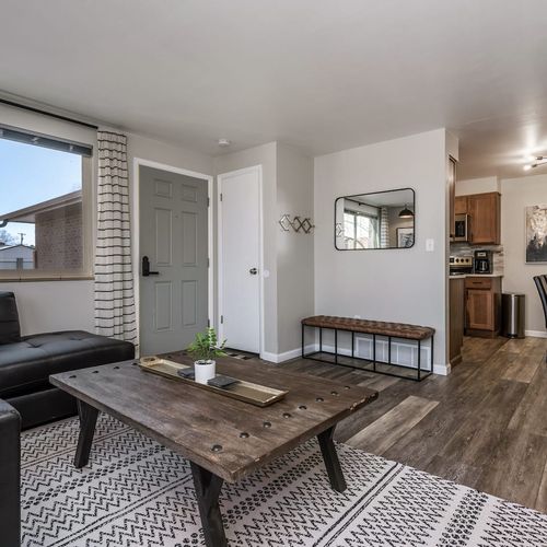- living space opens to a welcoming entry with wall hooks bench and mirror
- flows seamlessly into the kitchen and dining for effortless movement
- clean modern lines pair with comfort for a functional stylish entry zone