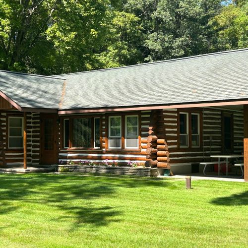 Exterior:  another view of the front of the cabin in summer.