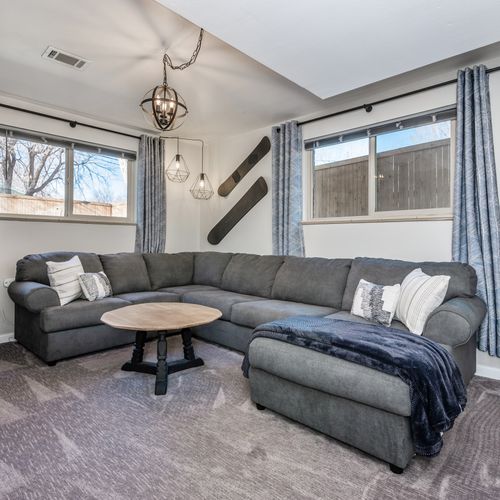 The downstairs living room has an extra spacious sectional for your group to comfortably gather.