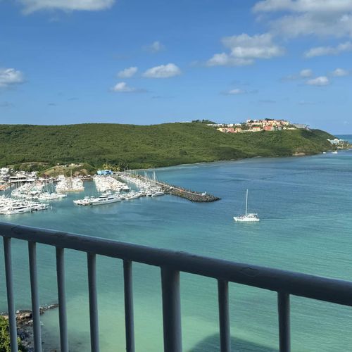 Breezy Balcony, Nautical Charm: This outdoor space offers a perfect vantage point to watch the boats drift by in the marina.