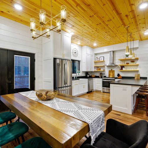 The living room seamlessly flows into the kitchen/dining area.