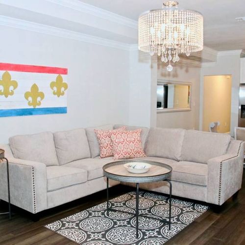Curl up in the bright, airy living room w/ plush seating & cozy accents.