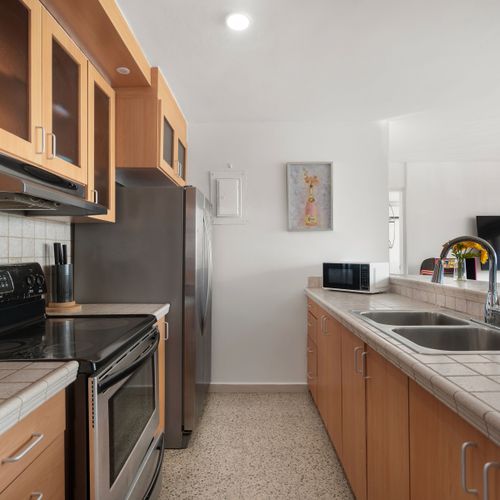 Modern appliances and ample counter space make meal preparation a breeze.