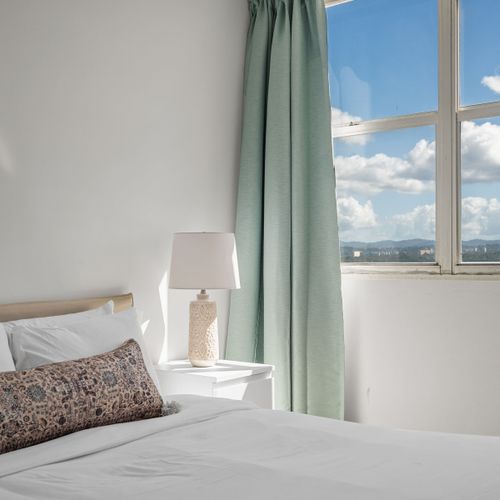 Unwind in style! This cozy bedroom provides a comfortable haven after a day of exploring, with picturesque views and a tranquil ambiance to ensure a restful night's sleep