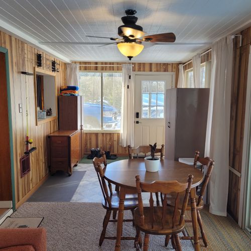 Dining area:  the new section of the cabin also includes a circular dining table with seating for 4 adults.