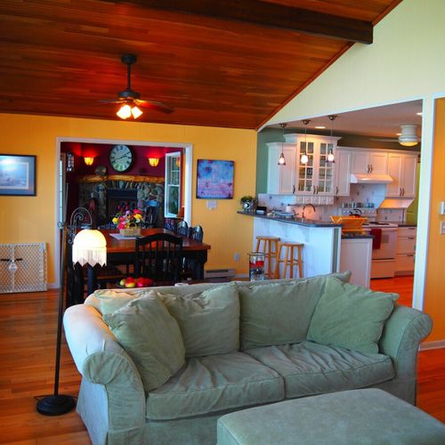 Upstairs living room:  the home has a beautiful living room with comfy furniture, a television with live streaming via roku, a ceiling fan, and spectacular views of crystal lake. (note that the fireplace is not for guest usage. )