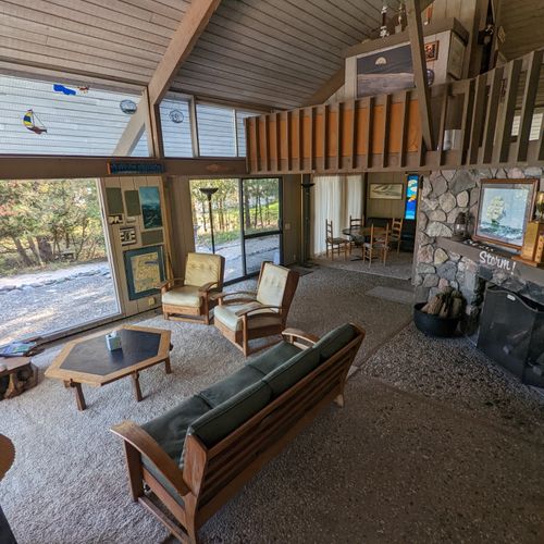 Living room #1:  the large open comfy living room with a tv and fireplace plus lots of windows for plenty of sunlight
