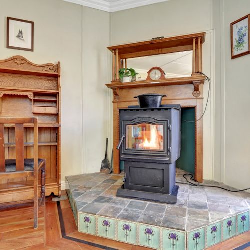 Warm corner workspace with vintage writing desk.