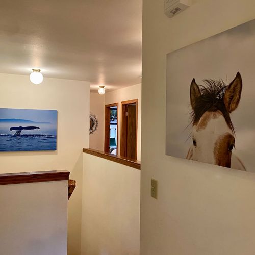 Head downstairs to the game room and third guest bedroom.